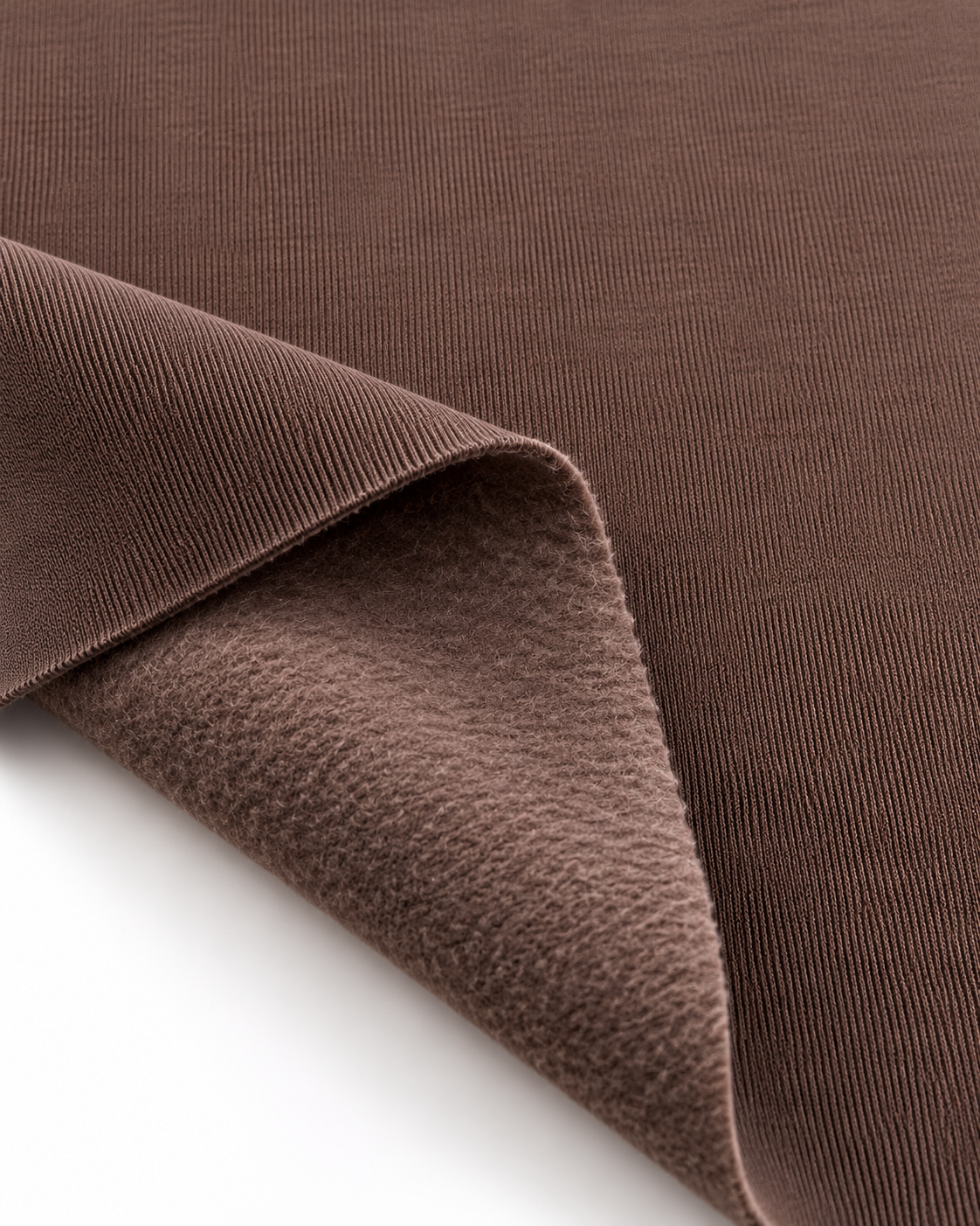 Chocolate brown brushed fleece fabric showing a smooth outer surface and soft fleece on the inside.