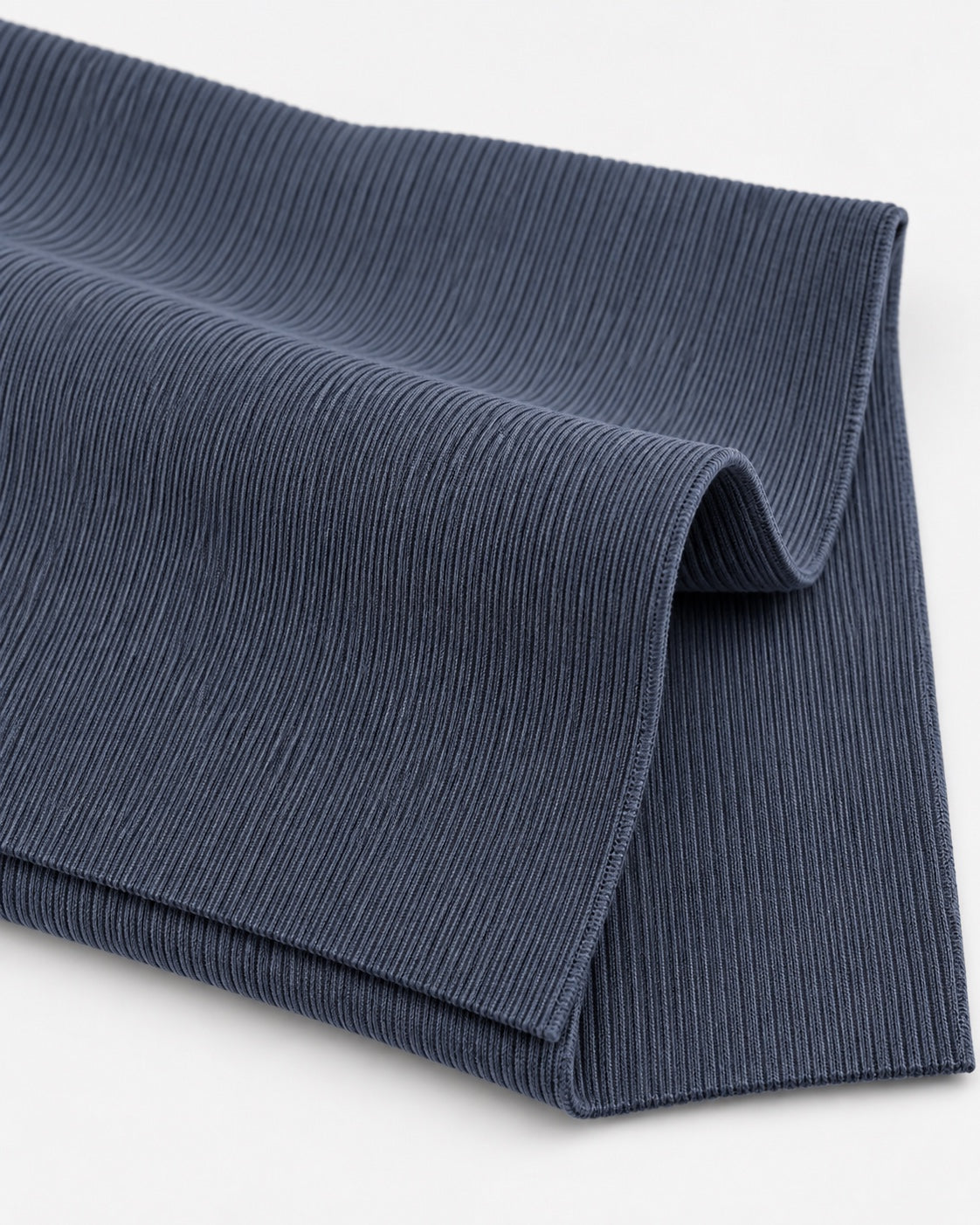 Iron grey rib knit fabric showing fine vertical ribs and a dense elastic texture.