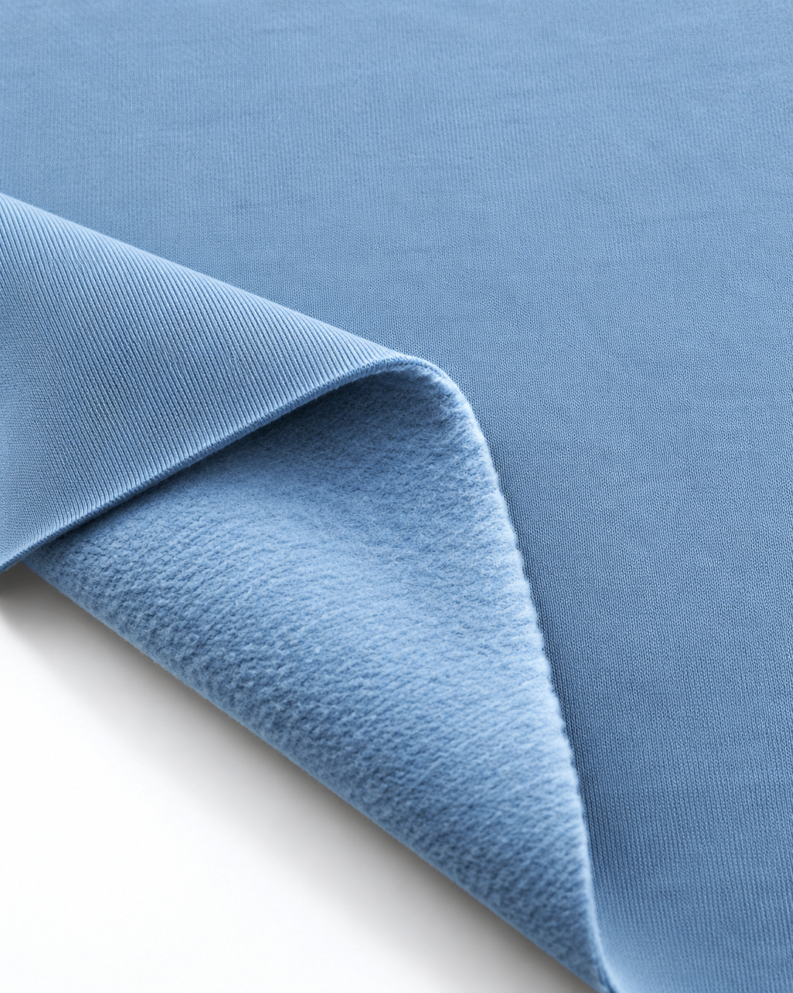 Light blue brushed fleece fabric showing a smooth outer surface and soft fleece on the inside.