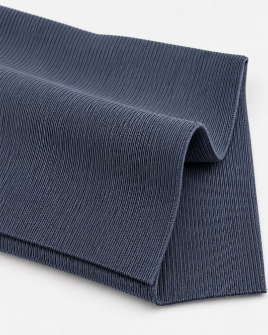 Iron grey rib knit fabric showing fine vertical ribs and a dense elastic texture.