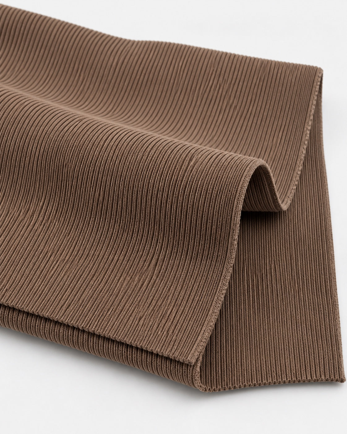 Latte rib knit fabric showing fine vertical ribs and a dense elastic texture.