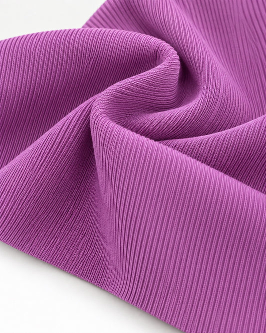Lavender rib knit fabric showing fine vertical ribs and a dense elastic texture.