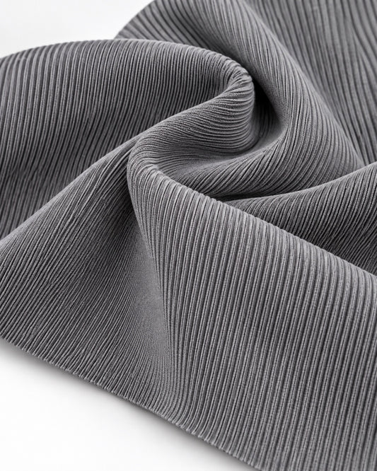 Light grey rib knit fabric showing fine vertical ribs and a dense elastic texture.